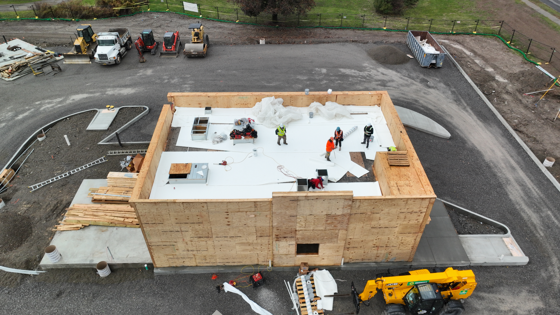 Aerial view of a Top Priority commercial new-build with TPO membrane roof underway